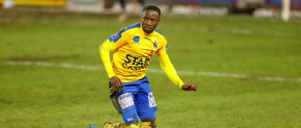 Waasland-Beveren s Serge Leuko and Mouscron s Serge Tabekou fight for the ball during a soccer match between Royal Excel